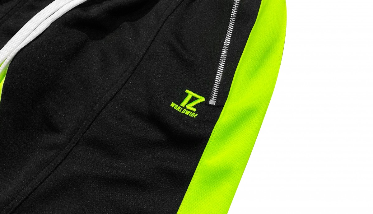 Black and neon green track pants 2025